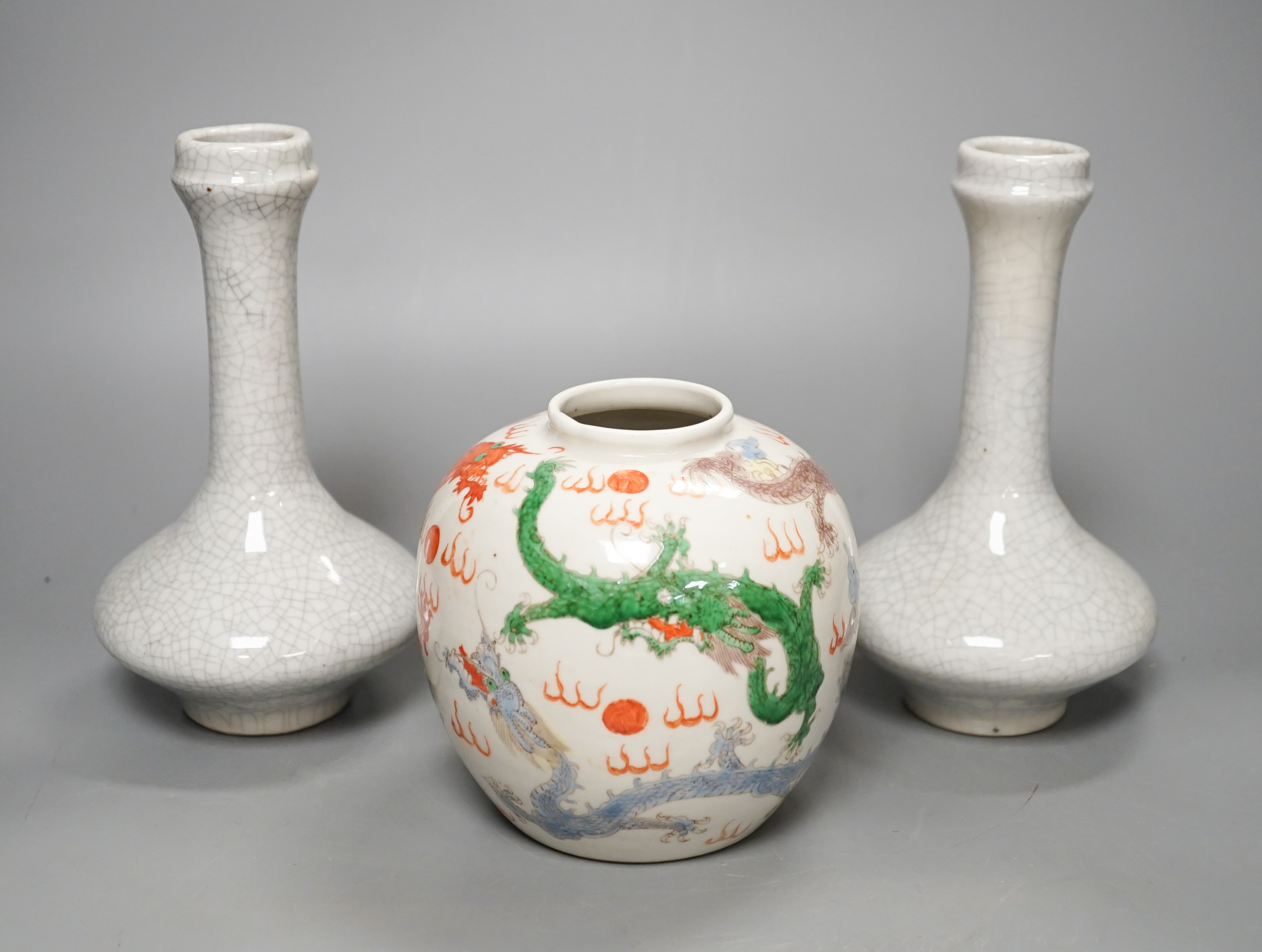 A Chinese enamelled porcelain 'dragon' jar and two crackleglaze bottle vases, tallest 19cm